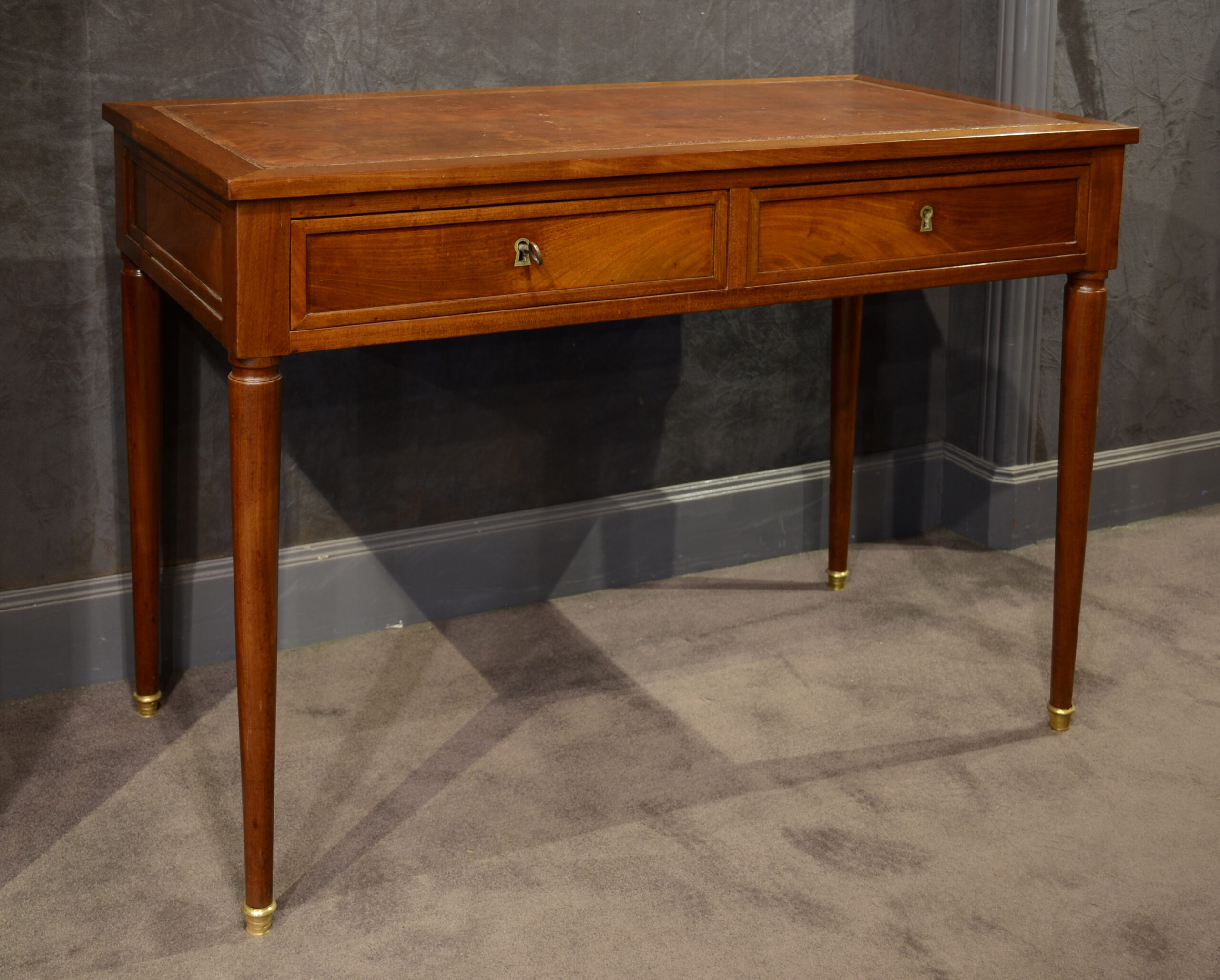 A Louis XVI mahogany writing table Etienne L VY