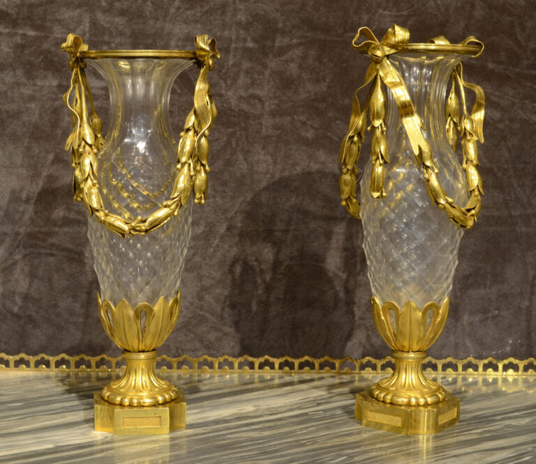 A fine pair of Louis XVI ormolu mounted cut-glass vases